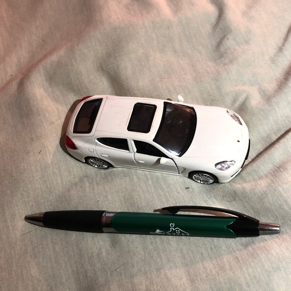 White Porsche Panamera S pull back action